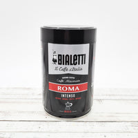 Blended Roma ground coffee in a tin