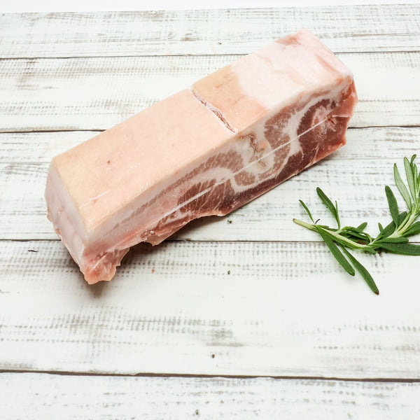 Slab of Spanish Chestnut Pork Belly Skin On available at Meat United
