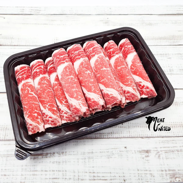 USDA Ribeye beef sliced with abundant marbling.